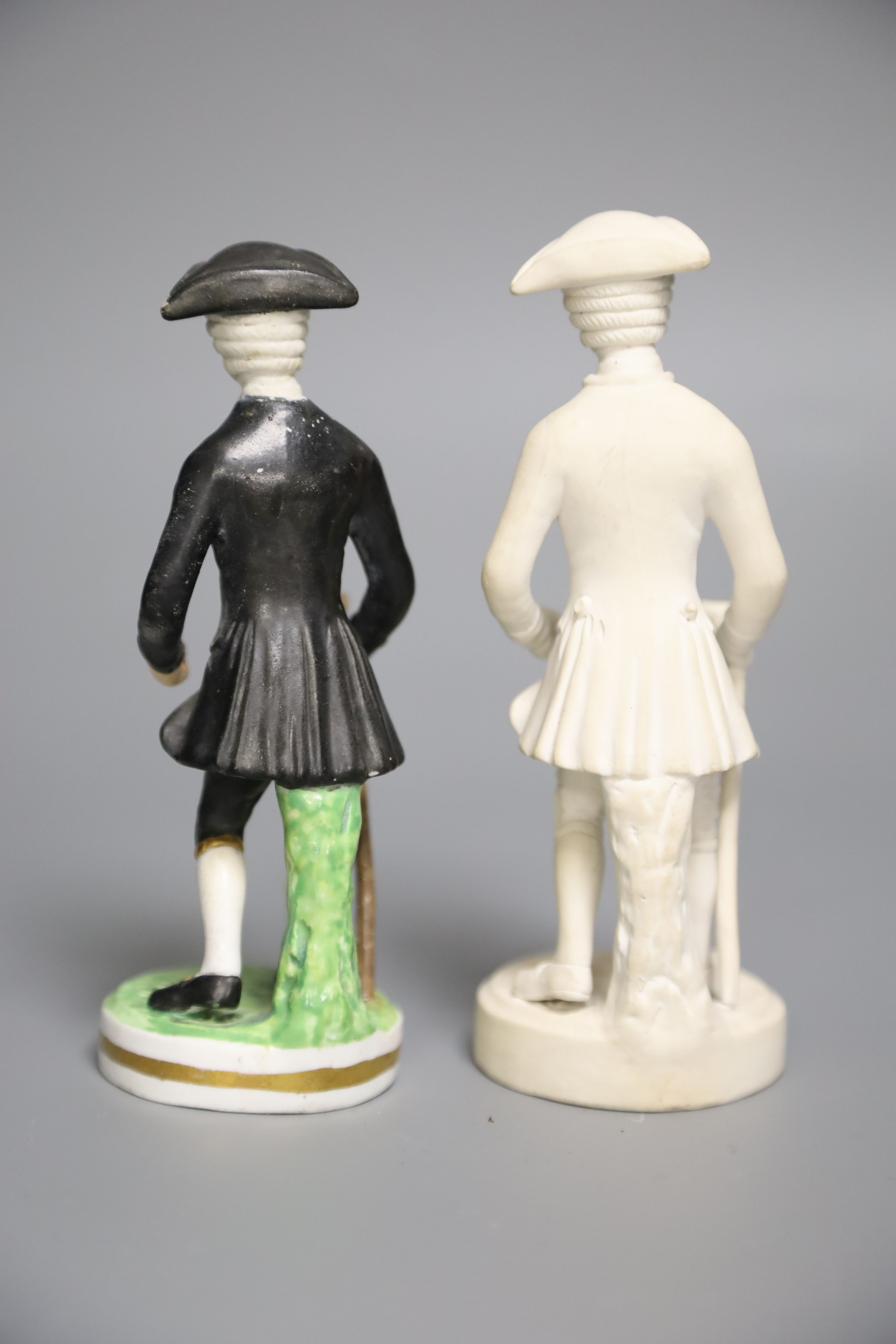 An early 19th century Derby rare biscuit figure of Dr. Syntax Walking and a later modelled Derby King Street of the same figure, 14cm